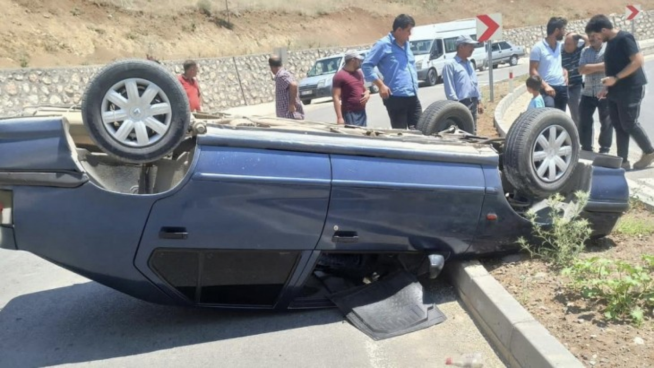 Ters dönen otomobilden burnu kanamadan çıktı